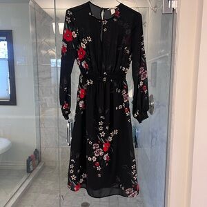 Beautiful floral dress with sheer details. Stunning on.